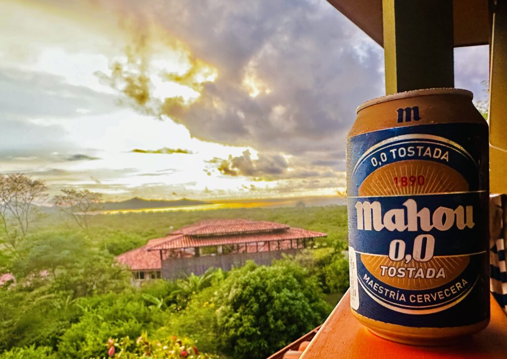 Mahou NA beer can on balcony railing