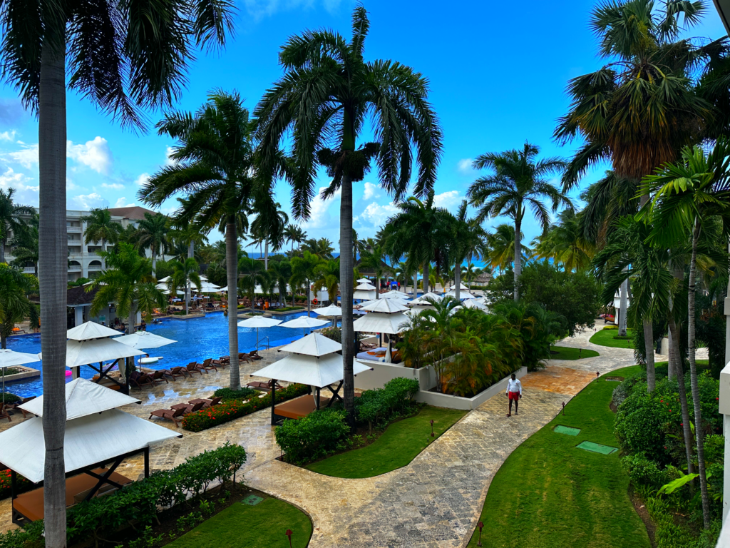 View of pools and palms at resort