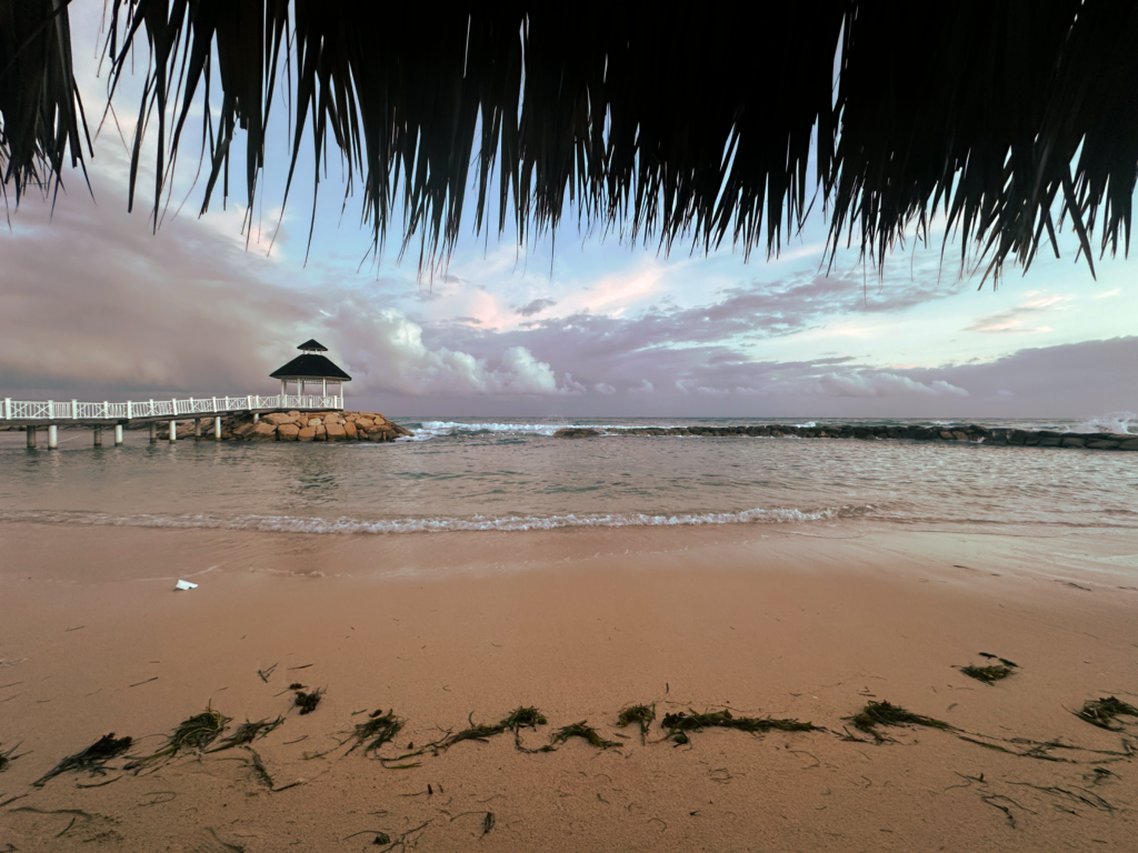 View of beach at sunrise from cabana