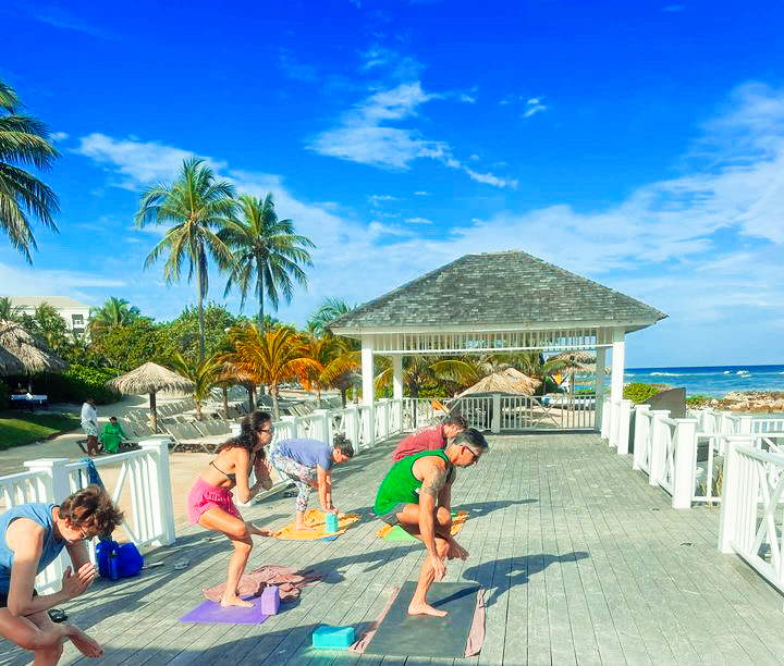 Yoga class by ocean