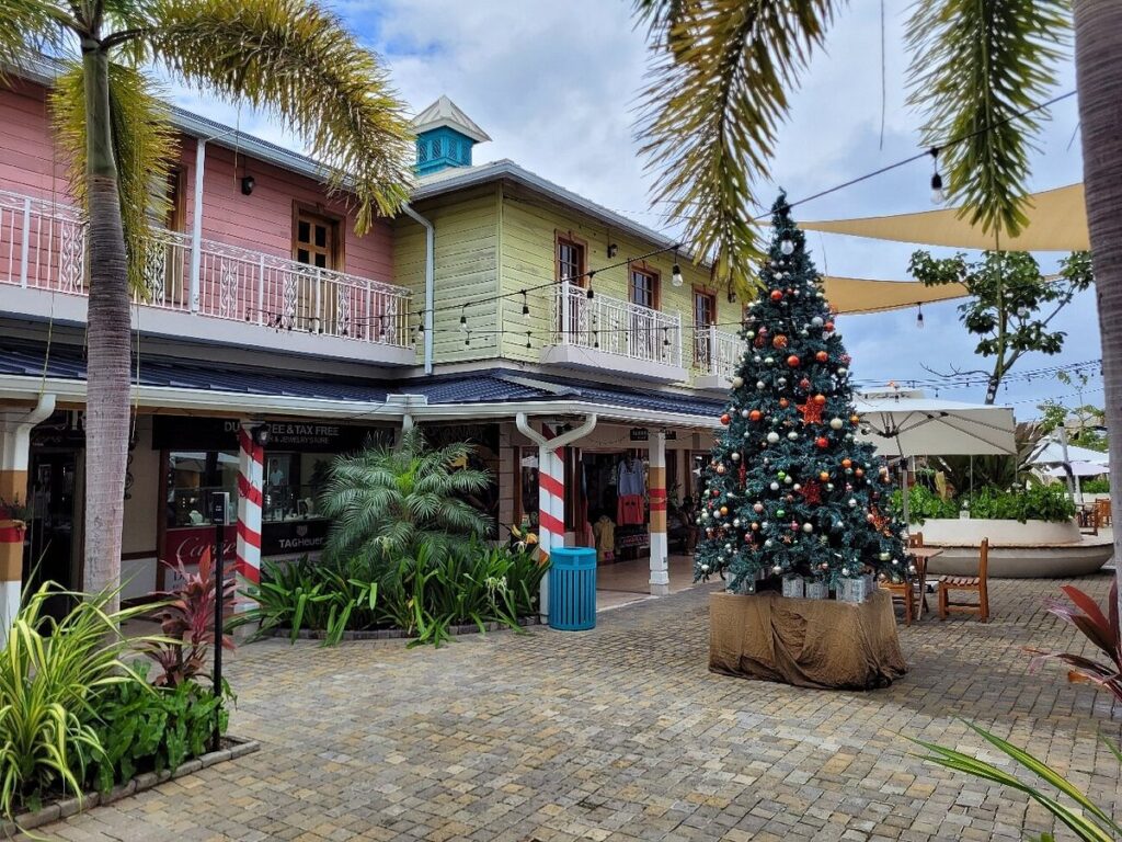 Colorful shops with Christmas tree in a courtyard