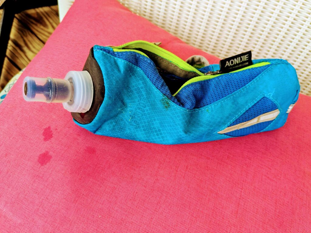 Running water bottle on pink seat cushion