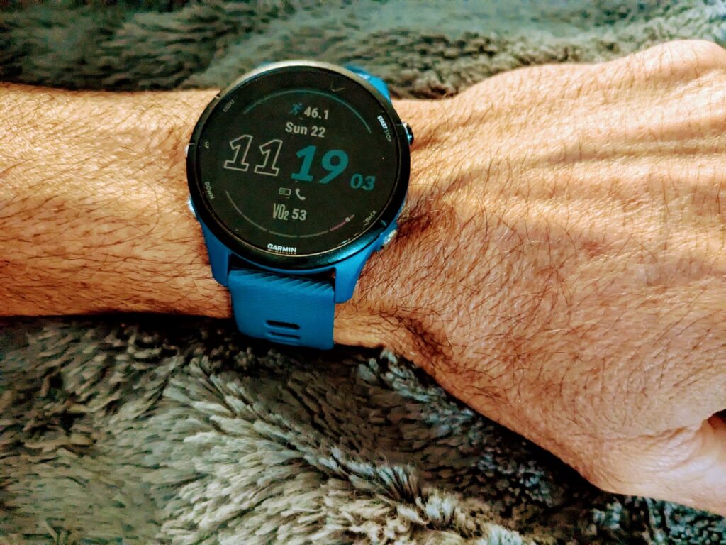 Blue Garmin Forerunner watch on man's wrist